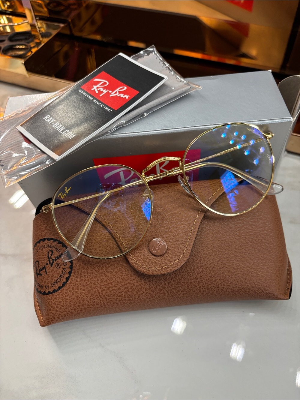 Ray-Ban “Evolve” Slim Gold Round Glasses with Clear Lenses